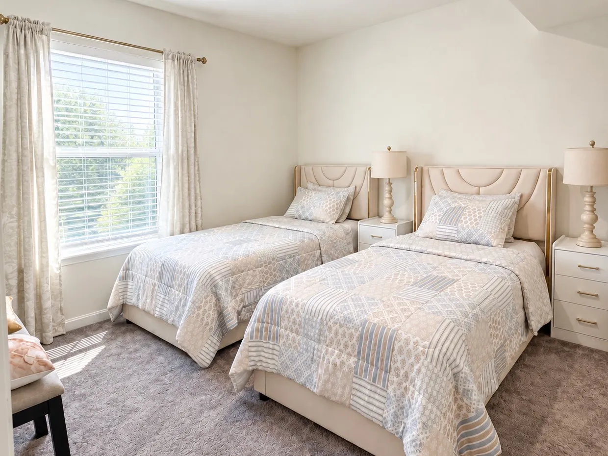 A bedroom with two beds. See more of life at Grace-Lift.